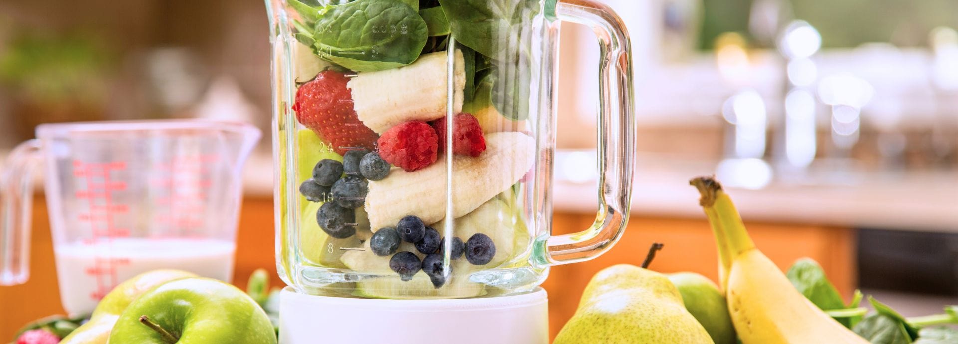 Unjury Protein Mixing Guide. Blender with fruit.